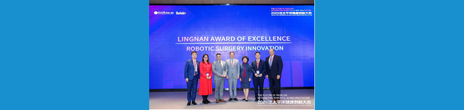 Lingnan awardees stand with presenters in front of a screen that reads "Lingnan award of excellence robotic surgery innovation"